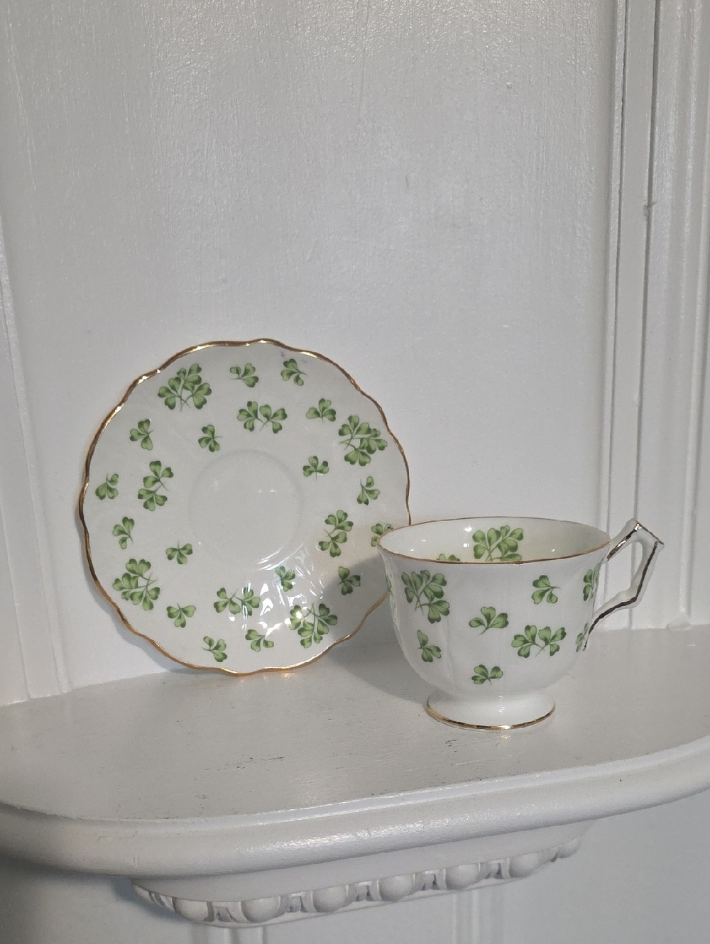 vintage Aynsley fine bone china teacup and saucer set featuring a green shamrock